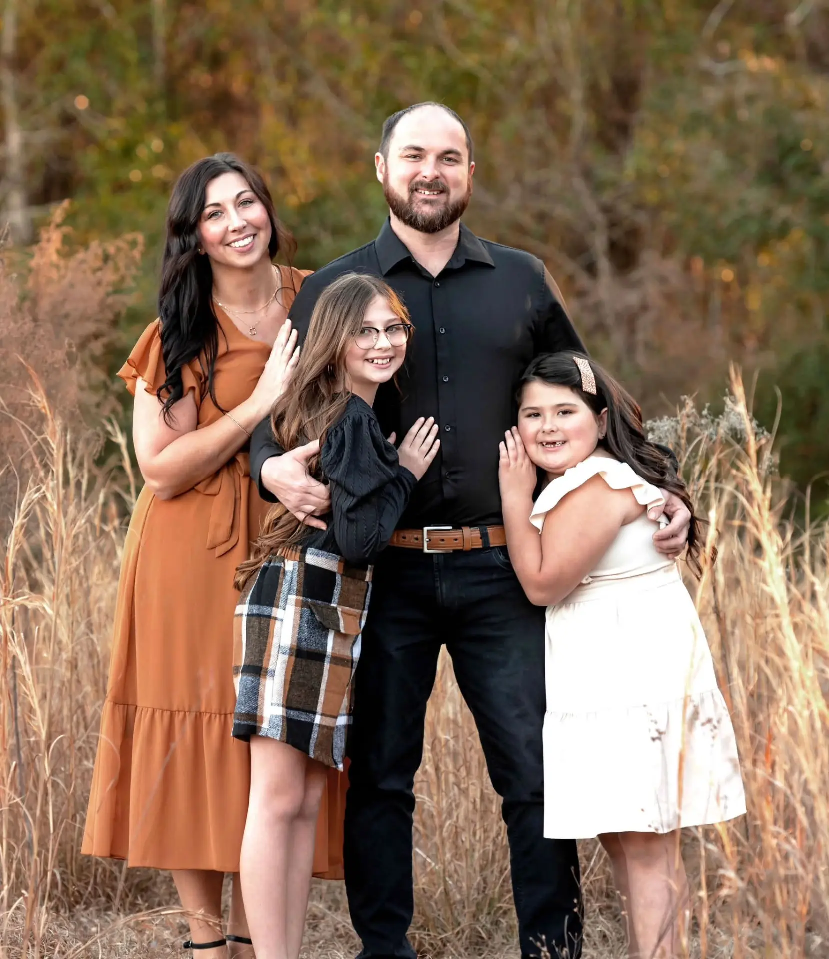 Michael Thrift with his wife Amber and their two daughters